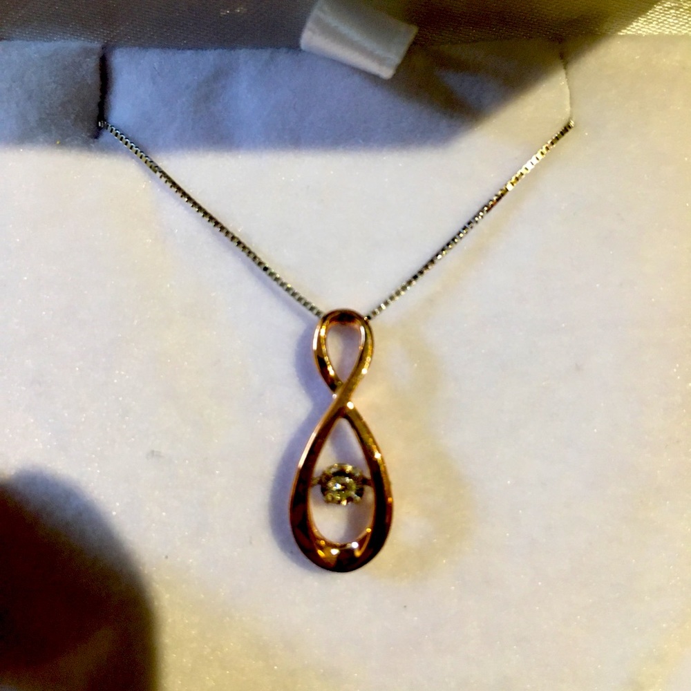 Rose gold infinity pendant with diamond